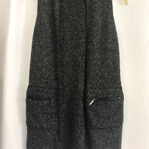 Woman’s grey sweater vest